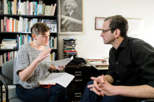 Russ Castronovo, professor of english, meets with a graduate student in the his office.(Photo by Bryce Richter / UW-Madison)